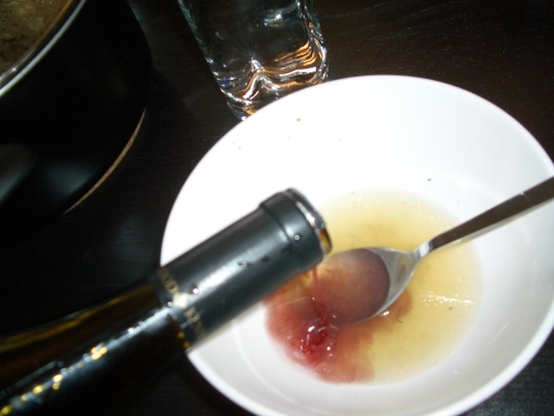 Pouring wine in the broth